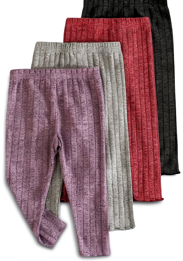 Baby girl wearing ribbed leggings in a cozy home setting